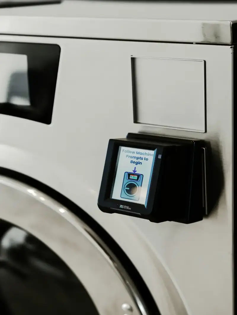 Tap-to-pay reader on a Speed Queen machine at Fresh Lab, Maylands